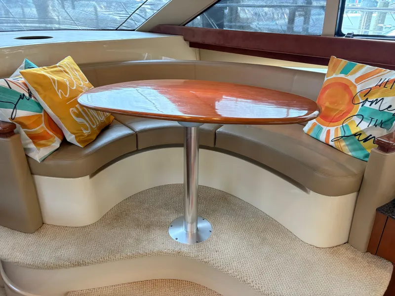 Slide: The Image of Luxurious 2006 Meridian Fly Bridge Convertible interior with curved seating and vibrant cushions. - 15