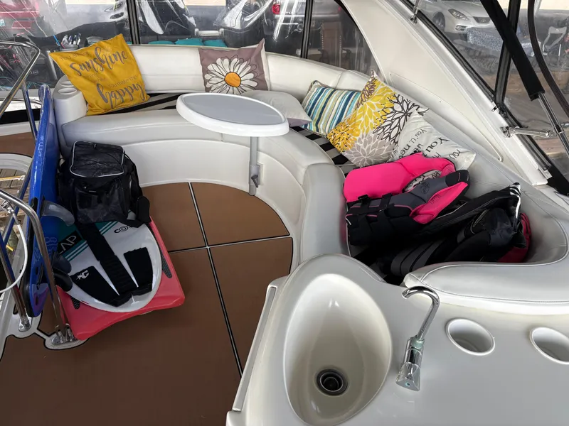 Slide: The Image of 2006 Meridian Fly Bridge Convertible interior with seating, pillows, and boating gear. - 6