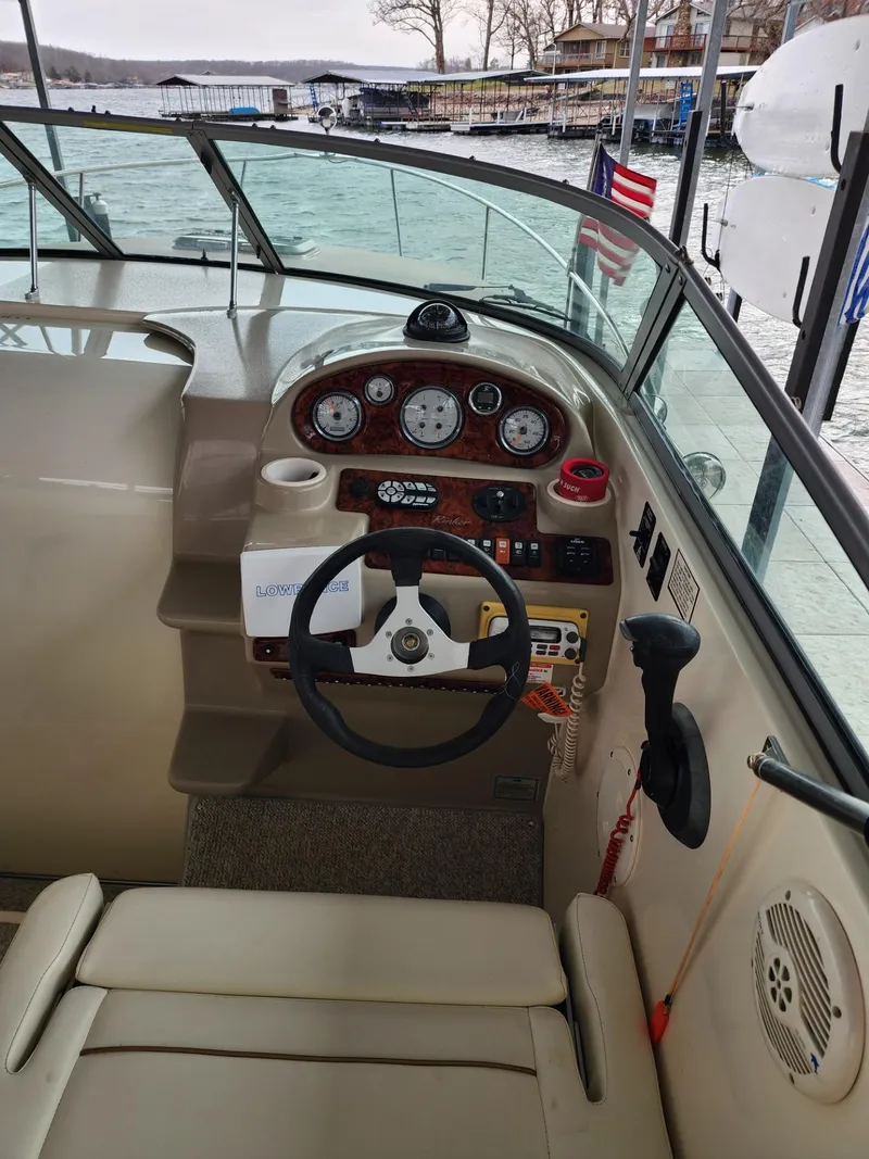 Slide: The Image of 2003 Rinker 270 Express Cruiser helm with steering wheel and instrument panel. - 16