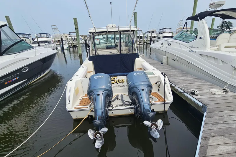 Slide: The Image of 2009 Pursuit OS 315 Offshore boat docked with twin 250 horsepower engines. - 4