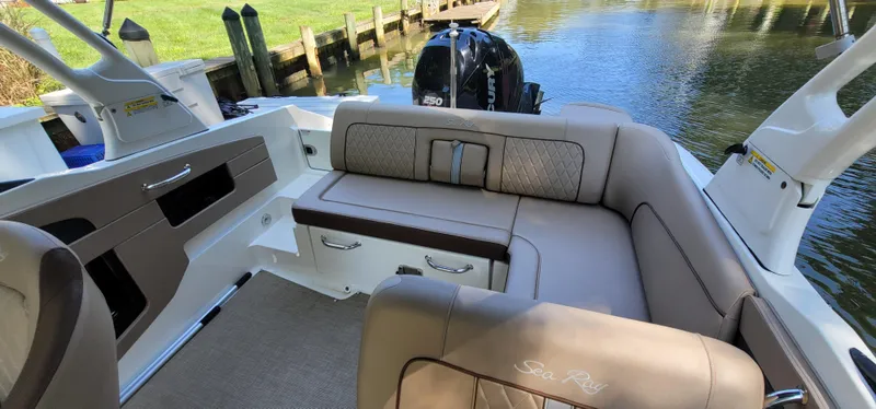 Slide: The Image of 2017 Sea Ray SDX 240 Outboard boat interior with luxurious seating and water view. - 15