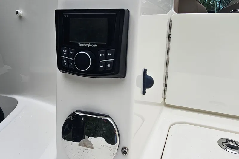 Slide: The Image of 2017 Sea Ray SDX 240 Outboard featuring Rockford Fosgate audio system controls. - 24