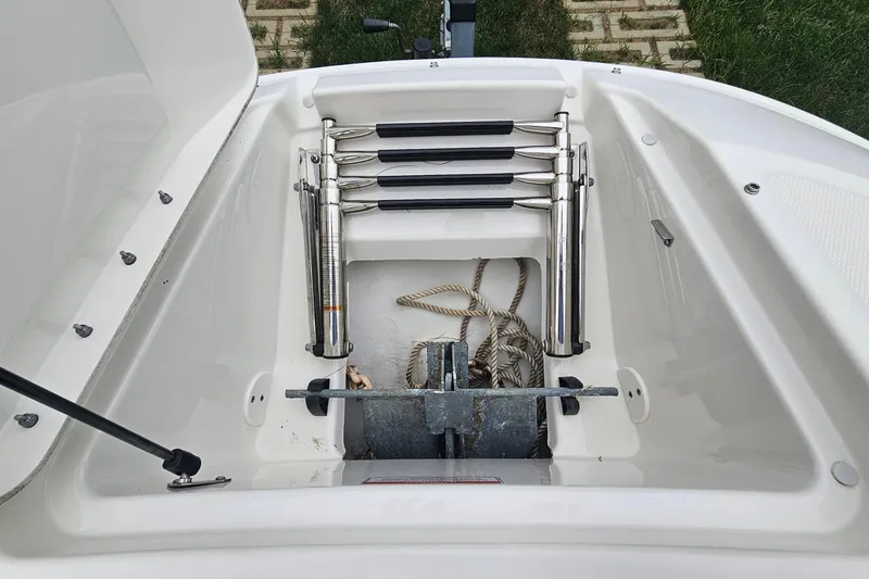 Slide: The Image of 2017 Sea Ray SDX 240 Outboard anchor storage with ladder and ropes. - 36