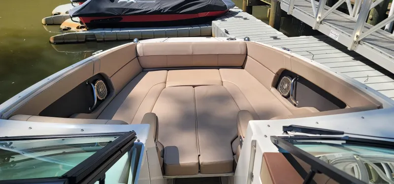 Slide: The Image of 2017 Sea Ray SDX 240 Outboard boat with spacious seating at dock. - 4