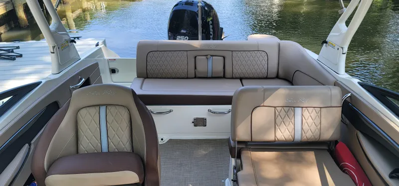 Slide: The Image of 2017 Sea Ray SDX 240 Outboard interior with luxurious seating and water view. - 6
