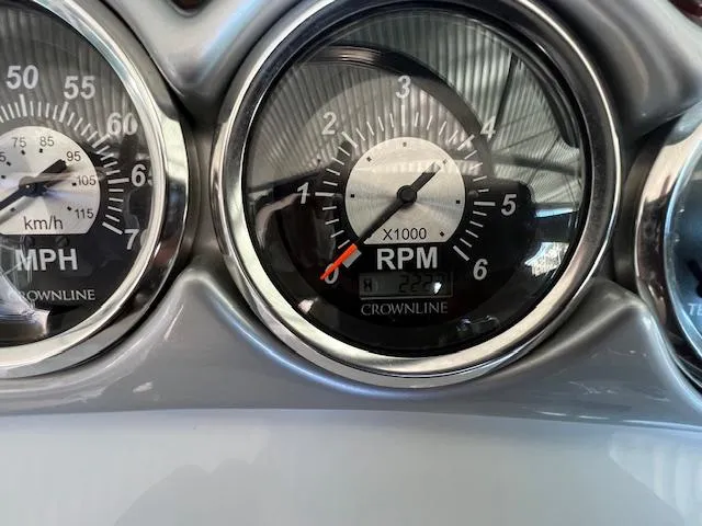 Slide: The Image of Close-up of 2012 Crownline 325 SS boat gauges displaying RPM and speed. - 16