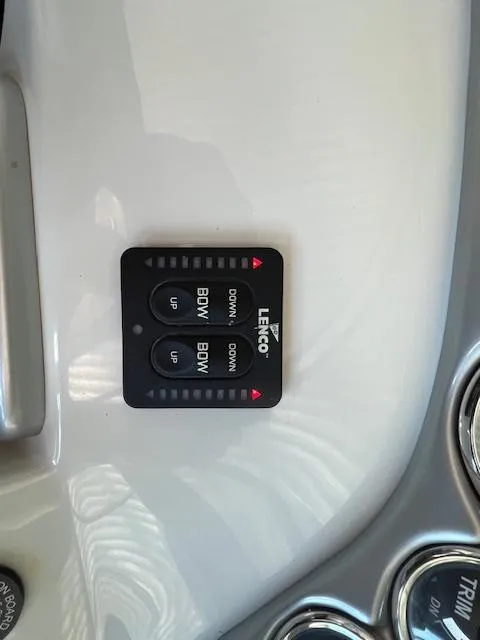 Slide: The Image of Control panel of a 2012 Crownline 325 SS boat with Lenco trim tab switches. - 20