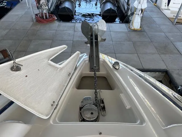 Slide: The Image of Bow of 2012 Crownline 325 SS boat with anchor and chain mechanism. - 41