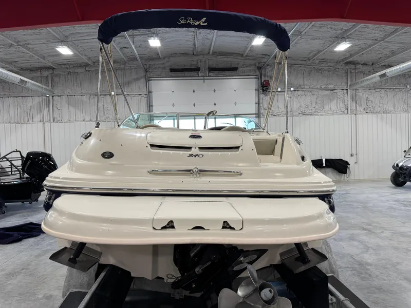 Slide: The Image of 2005 Sea Ray 240 Sundeck boat in a storage facility, rear view. - 5