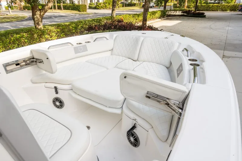 Slide: The Image of 2025 Sea Fox 228 Commander boat with luxurious white seating and cup holders. - 9