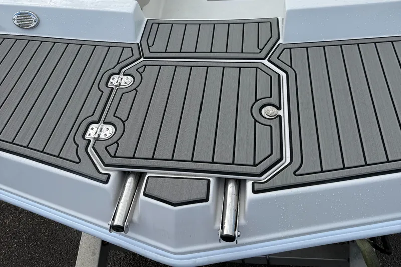 Slide: The Image of 2024 Starcraft SVX 171 OB boat deck with sleek gray design and stainless steel fittings. - 7