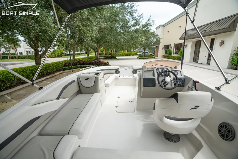 Slide: The Image of 2024 Starcraft SVX 191 OB boat interior with modern seating and steering console. - 11