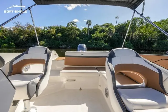 Slide: The Image of 2023 Starcraft SVX 231 OB DH boat interior with seating and canopy. - 8