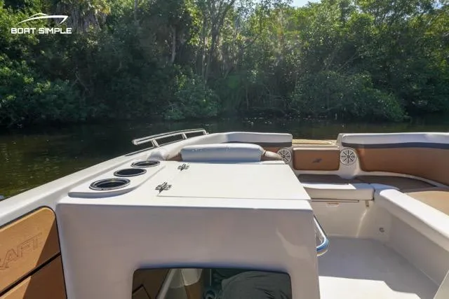 Slide: The Image of 2023 Starcraft SVX 231 OB DH boat interior with seating and cup holders. - 9