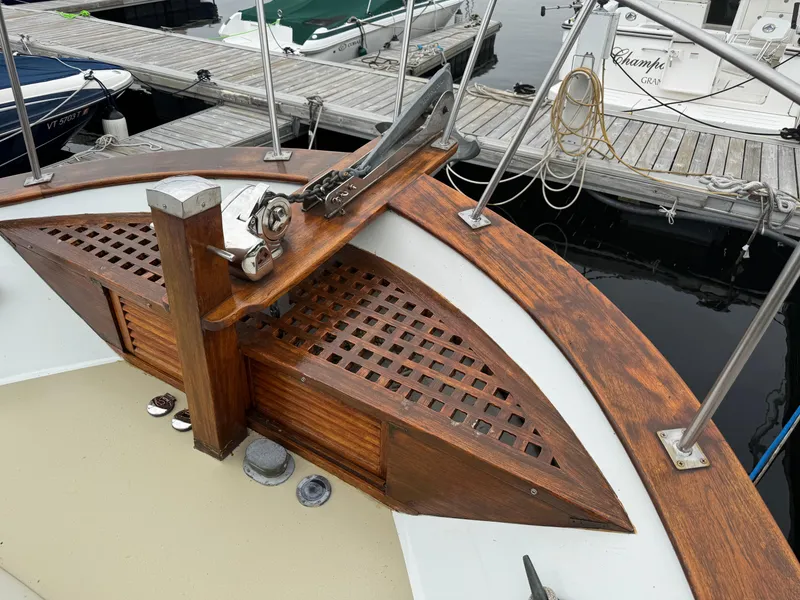 Slide: The Image of 1981 Marine Trader 34 Double Cabin boat deck with wooden details and docked at marina. - 16