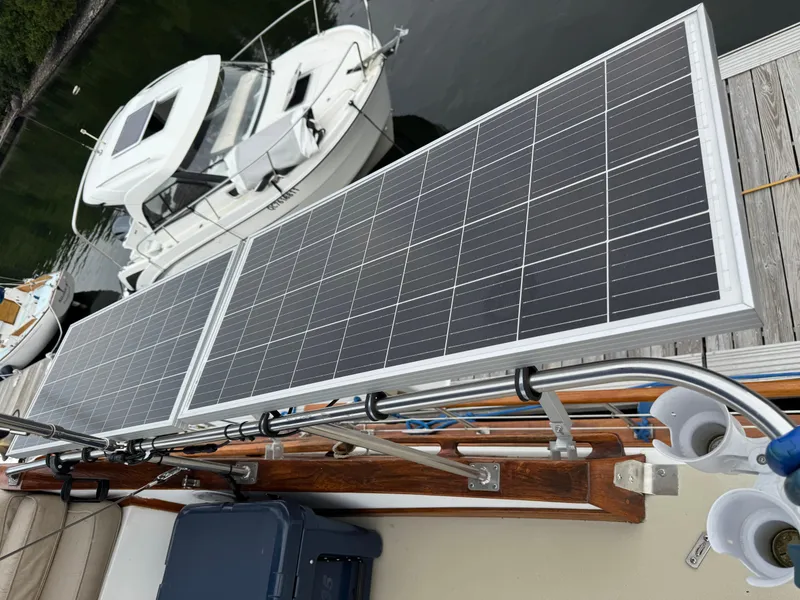 Slide: The Image of Solar panels on a 1981 Marine Trader 34 Double Cabin boat docked near water. - 27