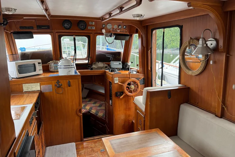 Slide: The Image of Interior of 1981 Marine Trader 34 Double Cabin with wooden finish and nautical decor. - 5