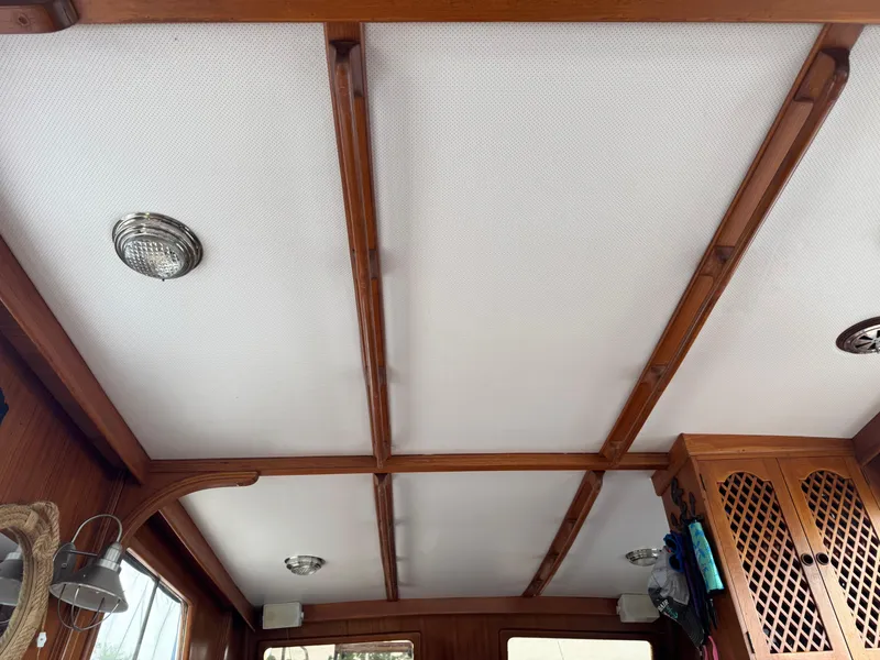 Slide: The Image of Interior ceiling of 1981 Marine Trader 34 Double Cabin with wooden beams and lights. - 8