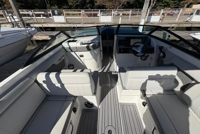 Slide: The Image of 2021 Sea Ray SDX 270 Outboard interior with sleek seating and modern dashboard design. - 13