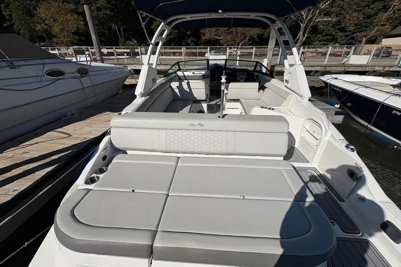 Slide: The Image of 2021 Sea Ray SDX 270 Outboard boat with spacious seating at a dock. - 14