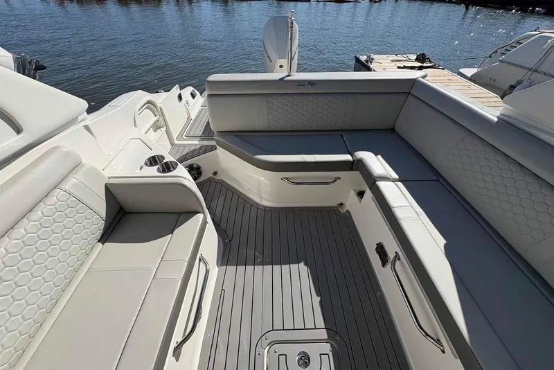 Slide: The Image of 2021 Sea Ray SDX 270 Outboard boat interior with luxurious seating and sleek design. - 21