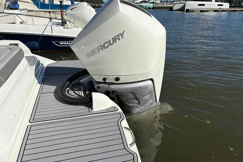 Slide: The Image of 2021 Sea Ray SDX 270 Outboard with Mercury engine in marina setting. - 23