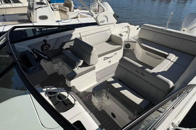 Slide: The Image of 2021 Sea Ray SDX 270 Outboard boat interior with luxurious seating and modern design. - 25