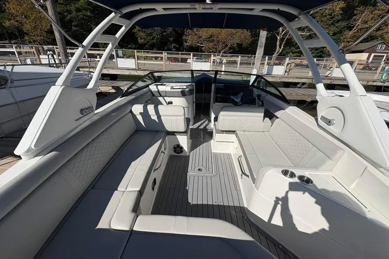 Slide: The Image of 2021 Sea Ray SDX 270 Outboard boat interior with spacious seating and modern design. - 27