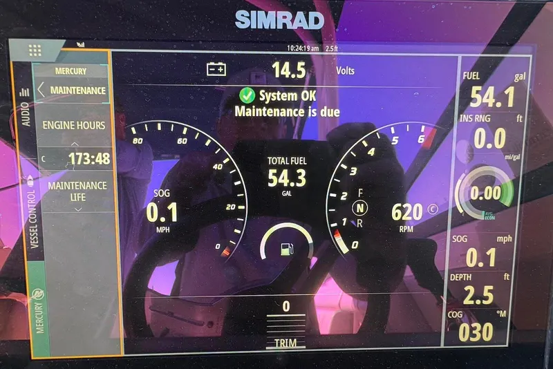 Slide: The Image of Simrad display on 2021 Sea Ray SDX 270 Outboard showing engine and fuel data. - 28