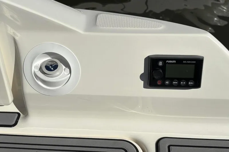 Slide: The Image of Control panel and speaker on 2021 Sea Ray SDX 270 Outboard boat. - 29