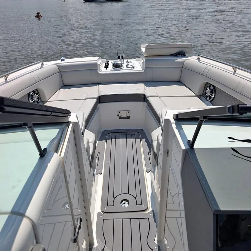 Slide: The Image of 2021 Sea Ray SDX 270 Outboard boat docked on a sunny day. - 4