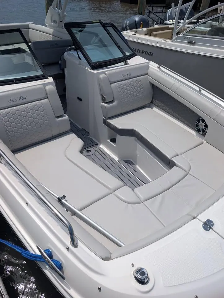 Slide: The Image of 2021 Sea Ray SDX 270 Outboard interior with luxurious seating and modern design. - 5