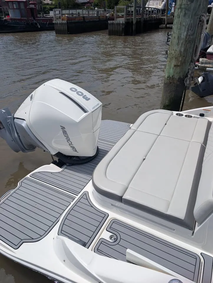 Slide: The Image of 2021 Sea Ray SDX 270 Outboard boat interior with spacious seating and modern design. - 7