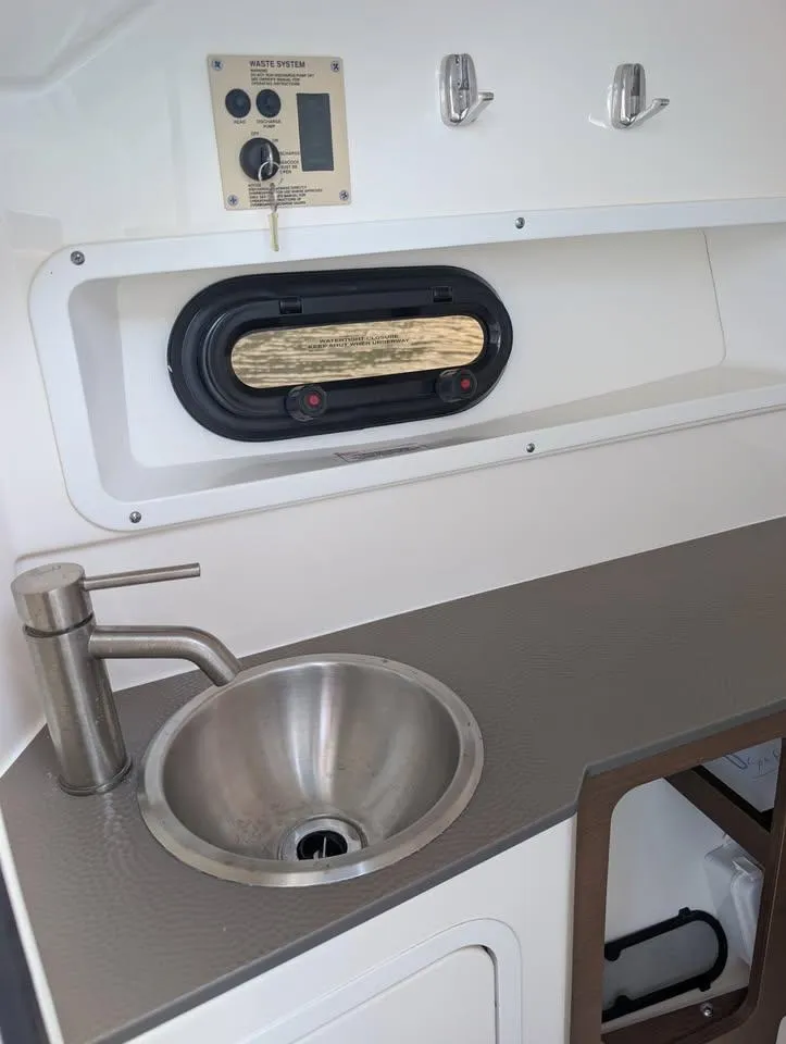 Slide: The Image of 2021 Sea Ray SDX 270 Outboard boat with luxurious seating and sleek design. - 8