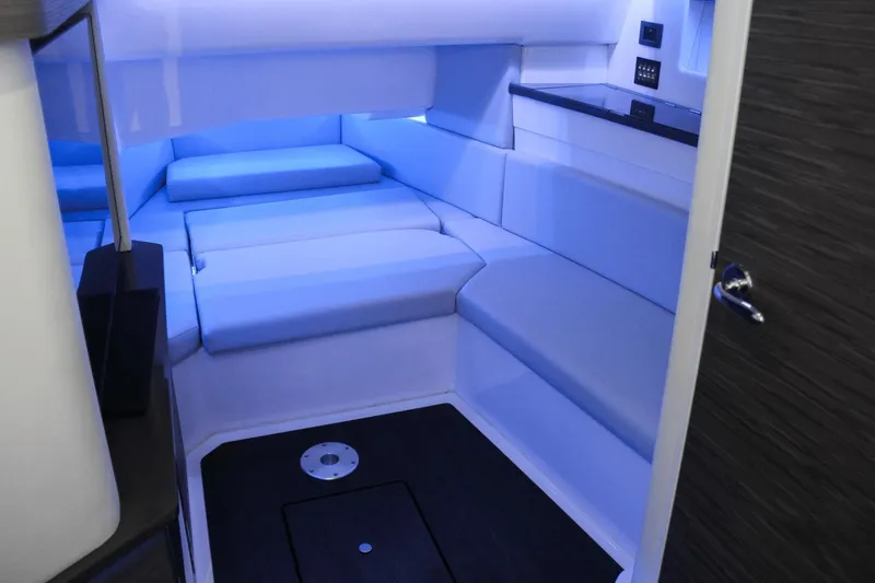 Slide: The Image of 2023 Aviara AV40 OB cabin interior with modern seating and ambient lighting. - 11