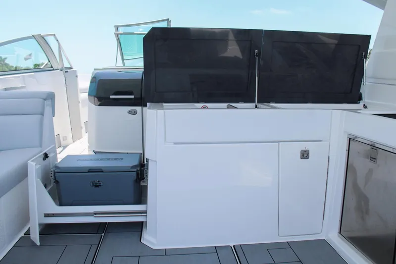 Slide: The Image of 2023 Aviara AV40 OB boat interior with sleek cabinetry and storage compartments. - 19