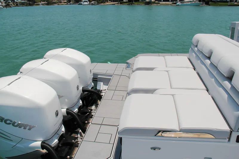 Slide: The Image of 2023 Aviara AV40 OB boat with triple Mercury outboard engines and spacious seating. - 22