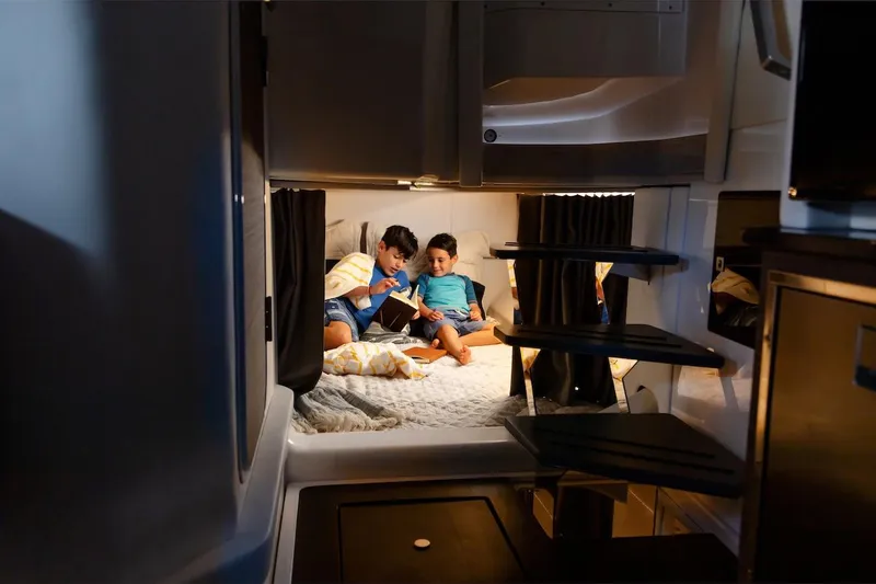 Slide: The Image of Manufacturer Provided Image: Children reading in cozy cabin of 2023 Aviara AV40 OB boat. - 3