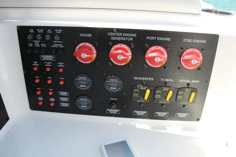 Slide: The Image of Control panel of 2023 Aviara AV40 OB boat with engine and system switches. - 4