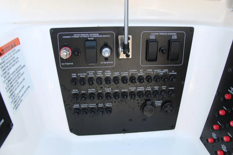 Slide: The Image of Control panel of 2023 Aviara AV40 OB boat with various switches and indicators. - 5