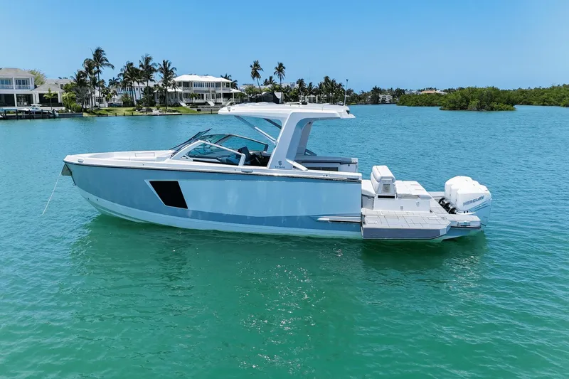 Slide: The Image of 2023 Aviara AV40 OB boat on turquoise water, with modern design and luxurious features. - 8