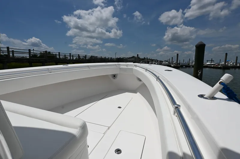 Slide: The Image of 2022 Contender 30 ST boat interior with clear sky and marina view. - 12