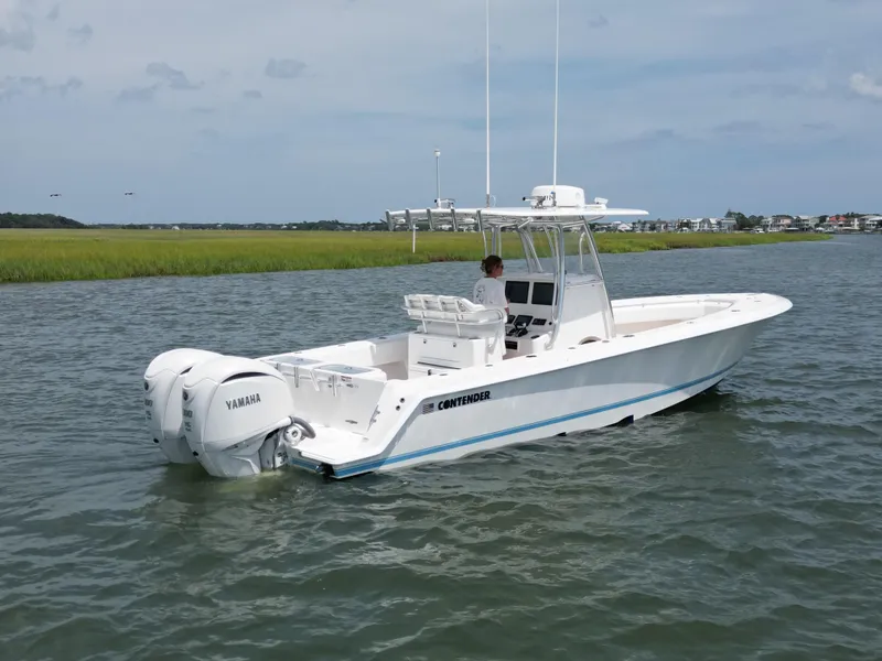 Slide: The Image of 2022 Contender 30 ST boat on water, featuring dual engines and sleek design. - 2