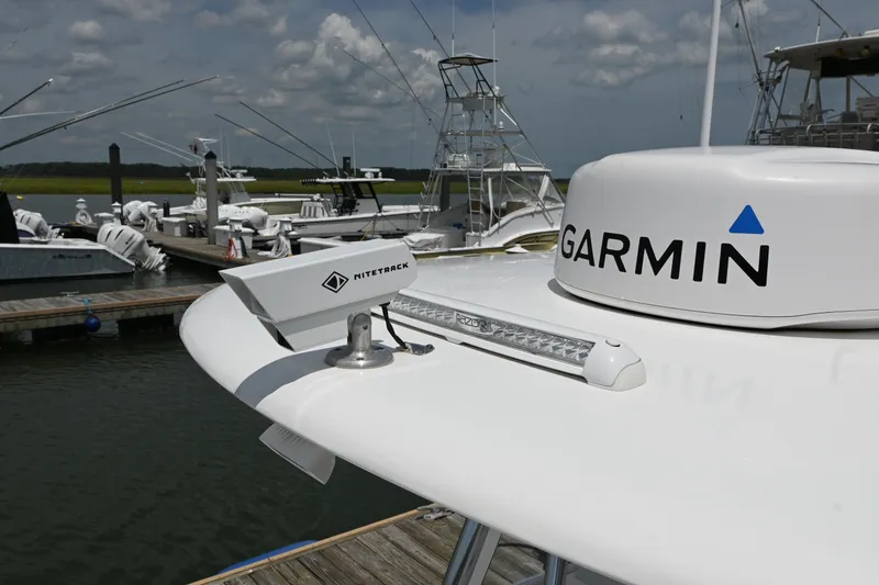 Slide: The Image of 2022 Contender 30 ST boat with Garmin and NiteTrack equipment at a marina. - 9