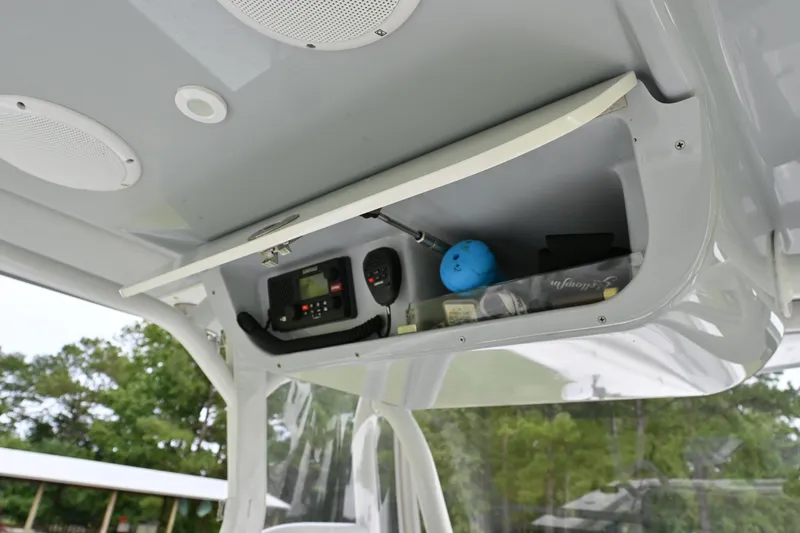 Slide: The Image of 2017 Yellowfin 36 boat console storage with radio and accessories. - 19