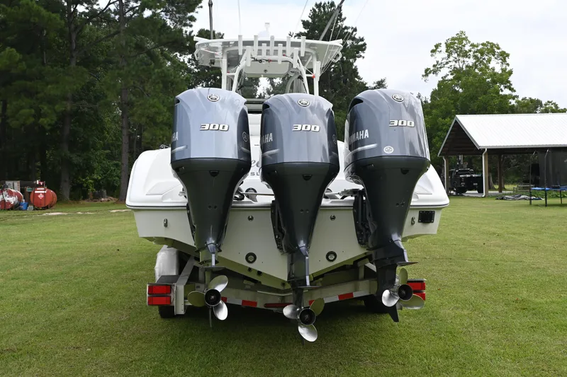 Slide: The Image of 2017 Yellowfin 36 boat with triple Yamaha 300 engines on grassy area. - 7