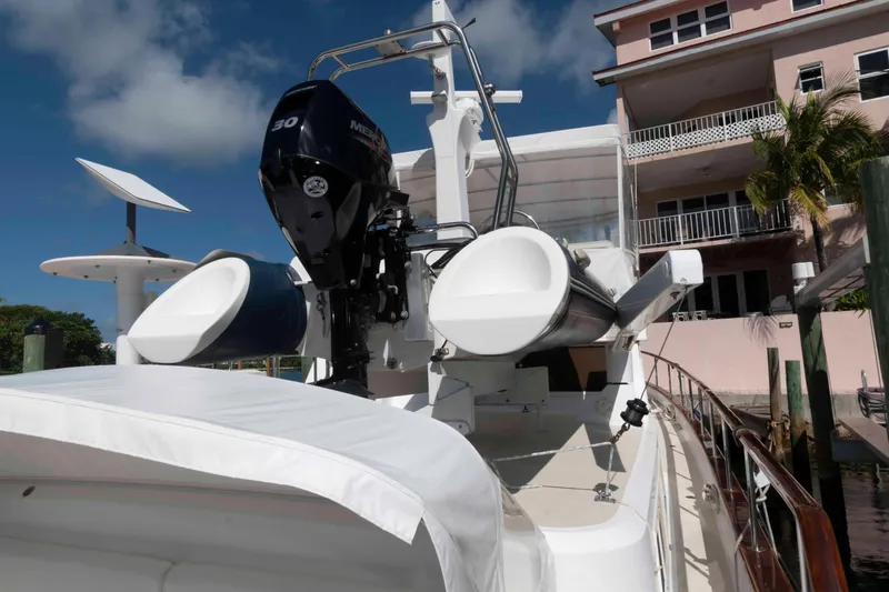 Slide: The Image of 1999 Ocean Alexander 486/510 Classico yacht docked near a pink building. - 19