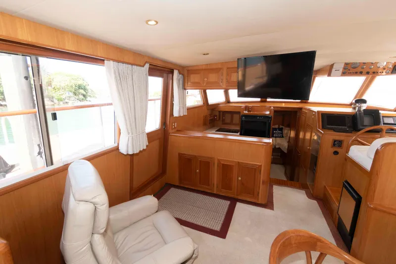 Slide: The Image of Interior of 1999 Ocean Alexander 486/510 Classico yacht with wood paneling and modern amenities. - 31