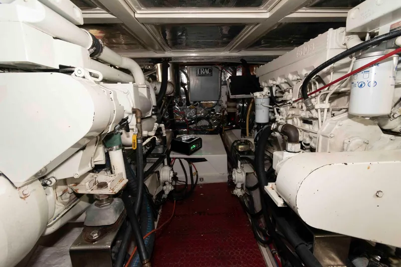 Slide: The Image of Engine room of 1999 Ocean Alexander 486/510 Classico yacht, showcasing dual engines and mechanical systems. - 46