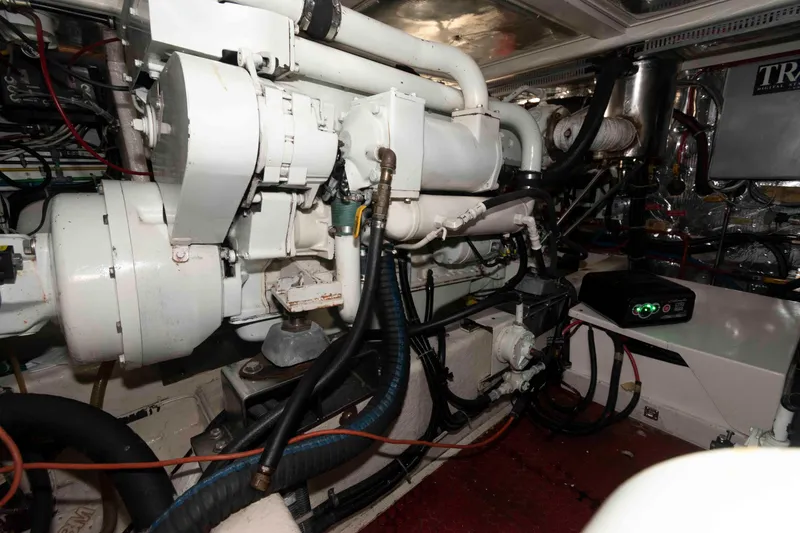 Slide: The Image of Engine room of 1999 Ocean Alexander 486/510 Classico yacht, showcasing mechanical components. - 48
